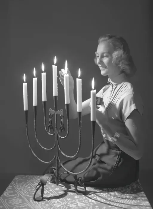 Framed Print : Christmas in the 1950s. Margit Sjoedin is lighting the candles at christmas