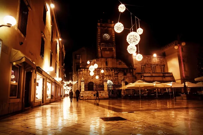 Framed Print : Christmas decorated square in red light in front of church Sveti Lovro