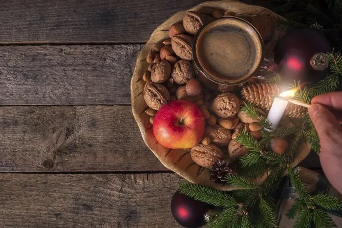 Framed Print : Christmas table with a wooden plate full with nuts