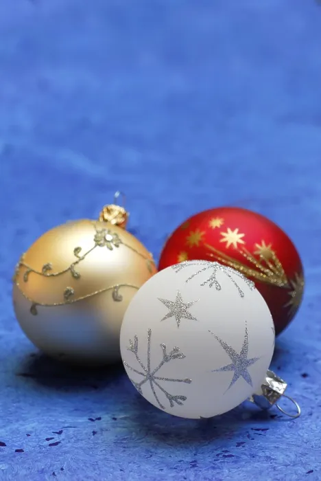 Framed Print : Christmas tree baubles on a blue background