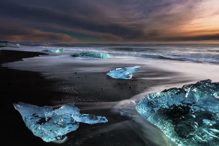 Framed Print : Chunks of ice on black lava sand beach at sunrise Framed Print : Chunks of ice on black lava sand beach at sunrise