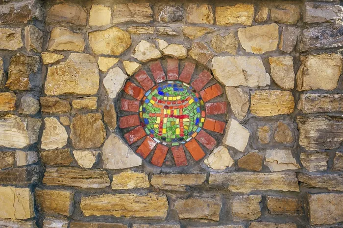Framed Print : Circular mosaic religious symbol of Shinto on stone wall