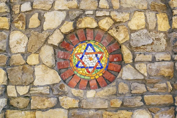 Framed Print : Circular mosaic religious symbol Star of David on stone wall