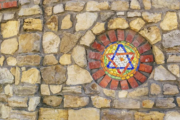 Framed Print : Circular mosaic religious symbol Star of David on stone wall