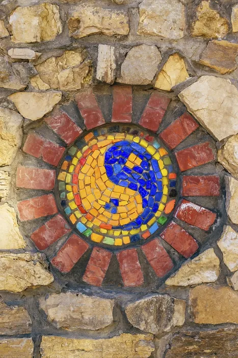 Framed Print : Circular mosaic religious symbol of Yin and yang on stone wall Framed Print : Circular mosaic religious symbol of Yin and yang on stone wall