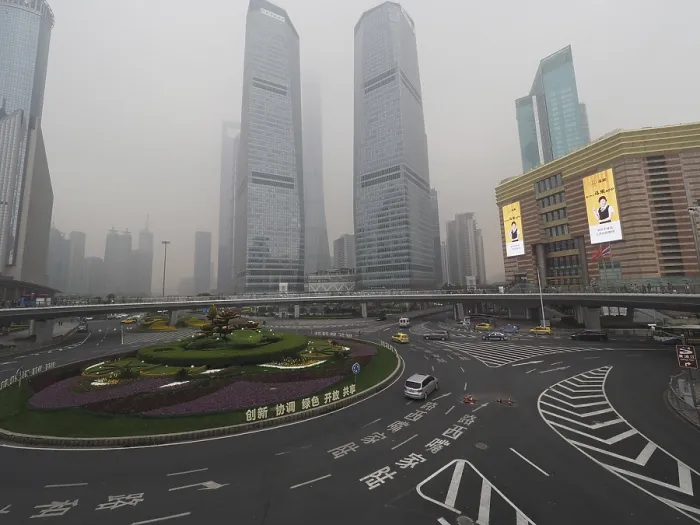 Framed Print : City scene with roundabout and skyscrapers in fog under grey sky