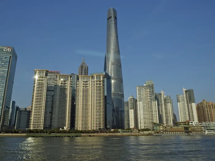 Framed Print : City skyline of Huangpu Jiang with tall modern buildings against blue sky on the water Framed Print : City skyline of Huangpu Jiang with tall modern buildings against blue sky on the water