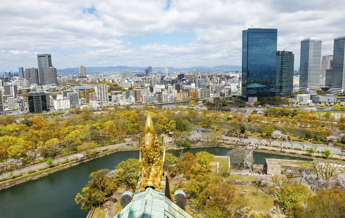 Framed Print : City view with skyscrapers and Osaka Castle Park with cherry blossoms