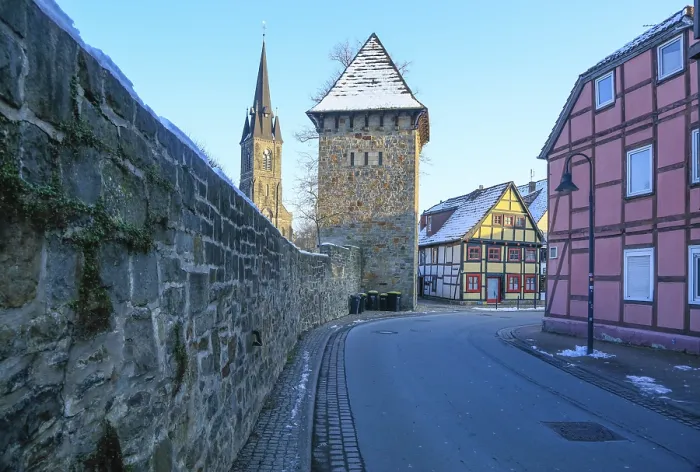Framed Print : City wall with tower, St. Sturmius Catholic Church Framed Print : City wall with tower, St. Sturmius Catholic Church