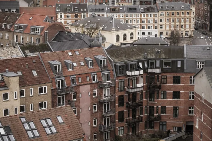 Framed Print : Cityscape featuring residential buildings with red tile roofs under an overcast sky in Aarhus