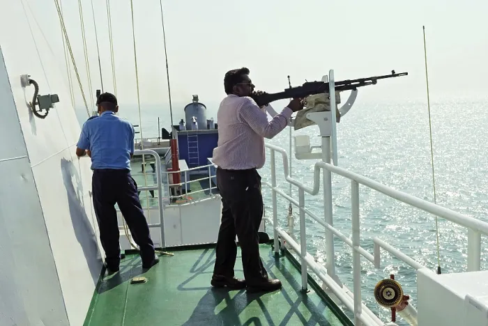 Framed Print : Civilian, tries his hand on locked machine gun