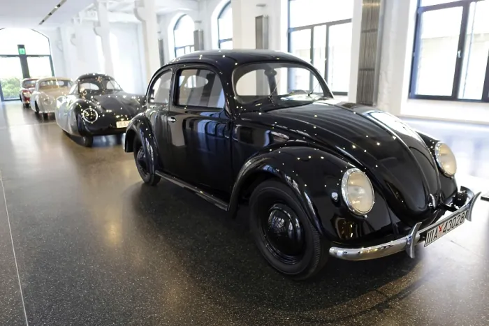 Framed Print : Classic black Volkswagen Beetle in a bright showroom Framed Print : Classic black Volkswagen Beetle in a bright showroom