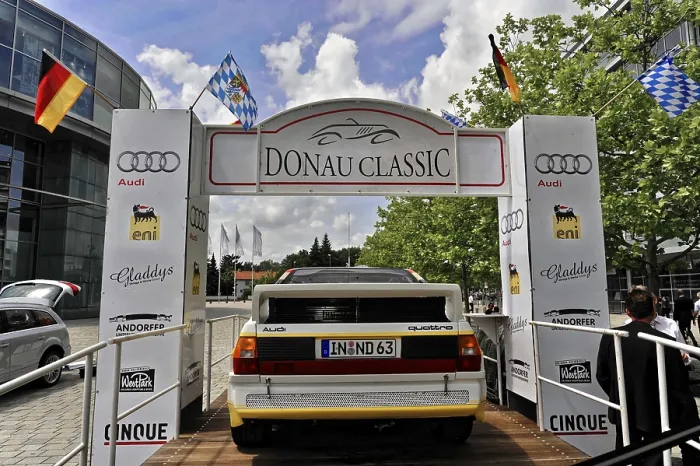 Framed Print : Classic car at the Donau Classic in front of a starting point with flags
