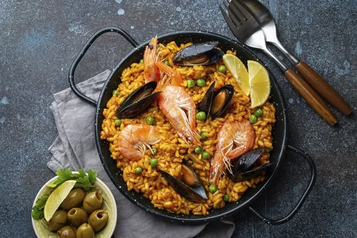 Framed Print : Classic dish of Spain, seafood paella in traditional pan on rustic blue concrete background top view Framed Print : Classic dish of Spain, seafood paella in traditional pan on rustic blue concrete background top view