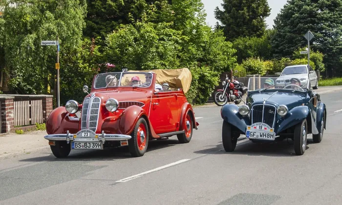 Framed Print : Two classic vintage cars, a red and a blue car