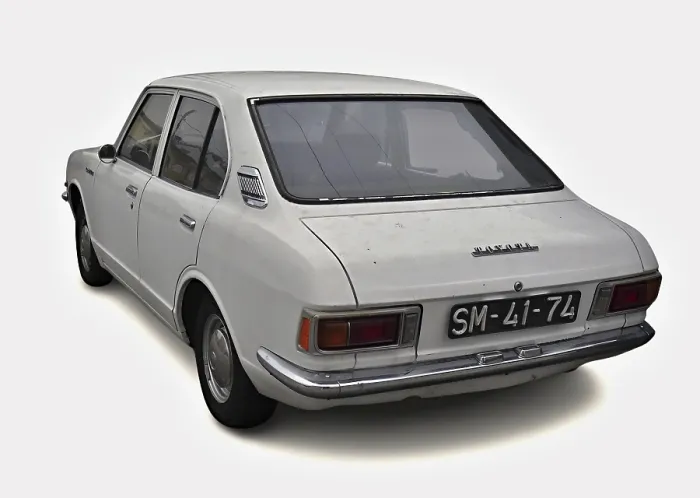Framed Print : Classic white Toyota Corolla parked on white background