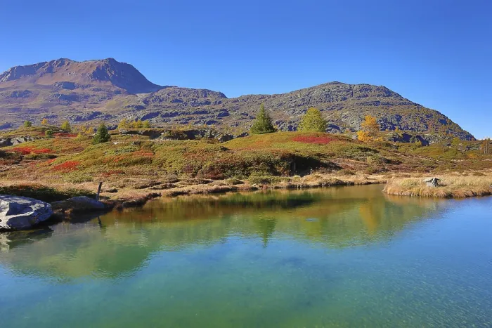 Framed Print : Clear reflections in a mountain lake with autumnal landscape and blue sky Framed Print : Clear reflections in a mountain lake with autumnal landscape and blue sky