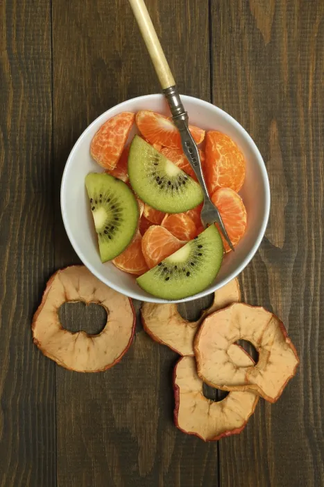 Framed Print : Clementine pieces and kiwi slices in peel