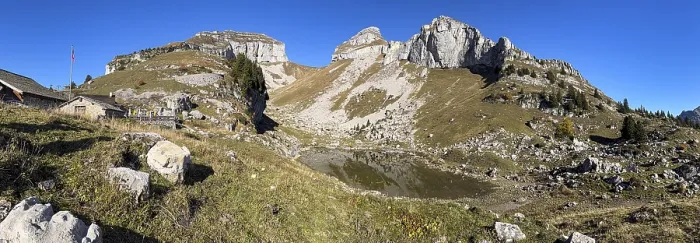 Framed Print : Cliffs at Tour de Mayen with a small mountain lake Lac de Mayen
