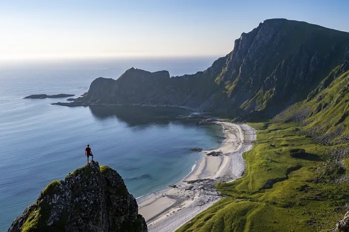 Framed Print : Climber on a rock, view of picturesque coastal landscape