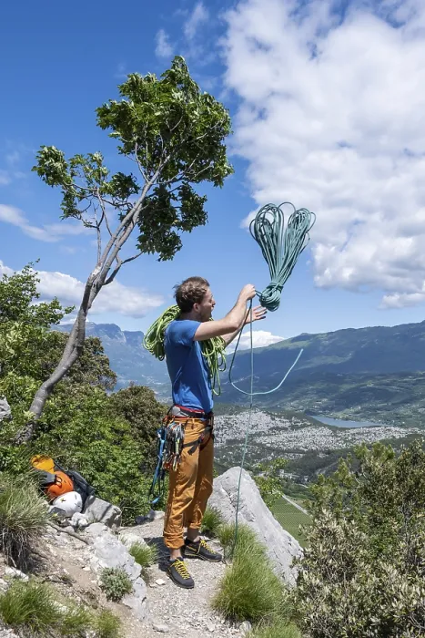 Framed Print : Climber throws climbing rope over his shoulder