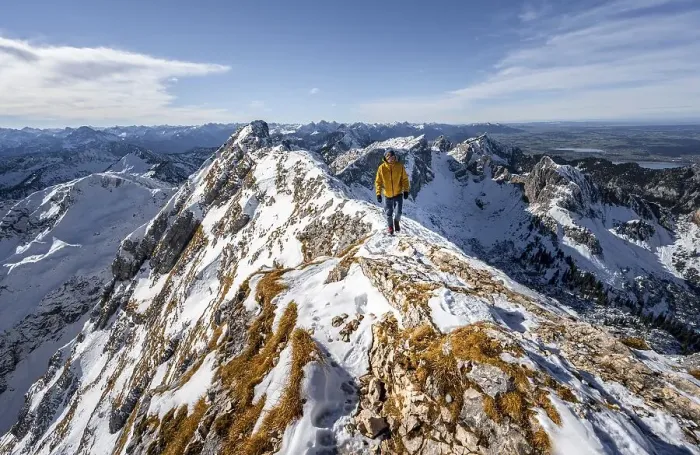 Framed Print : Climbers on a narrow rocky snowy ridge