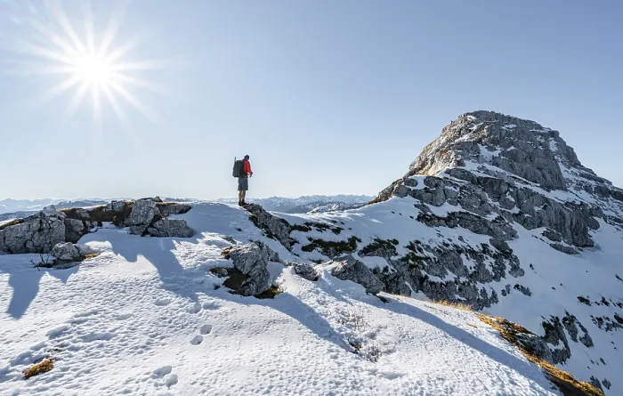 Framed Print : Climbers on the rocky summit ridge with first snow in autumn