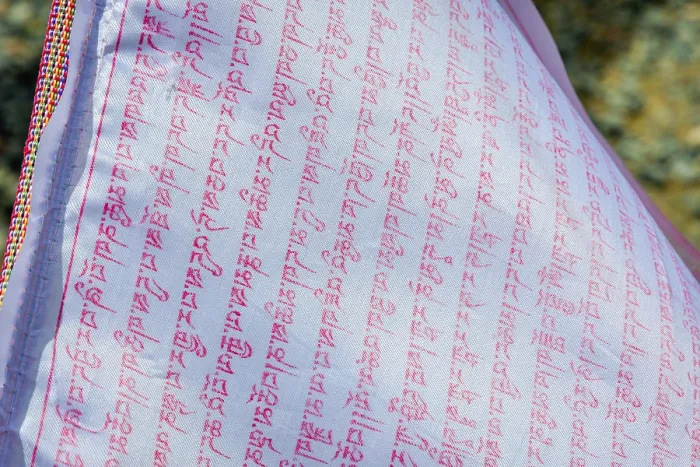 Framed Print : Close up of buddhist prayers on the white praying flag
