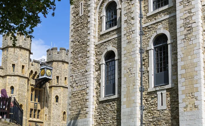 Framed Print : Close perspective of stone building with windows surrounded by greenery at The Tower of London
