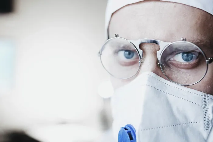 Framed Print : Close-up of a doctor with glasses and face mask Framed Print : Close-up of a doctor with glasses and face mask