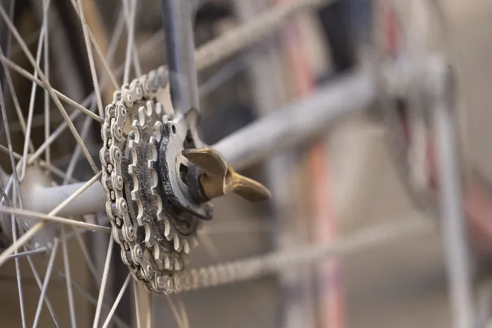 Framed Print : Close-up of a dusty bicycle sprocket and blurred background