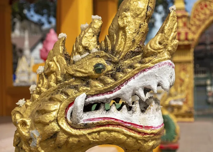 Framed Print : Close-up of gilded Naga, guardian deity