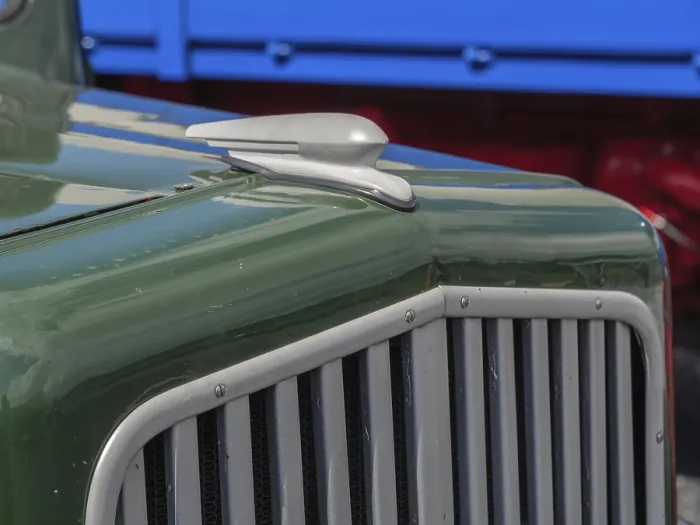 Framed Print : Close-up of a green classic car with distinctive radiator grille and bodywork details