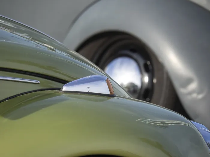 Framed Print : Close-up of a green vintage car with shiny chrome and headlights