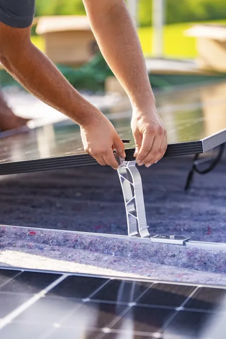 Framed Print : Close-up of hands installing a solar panel