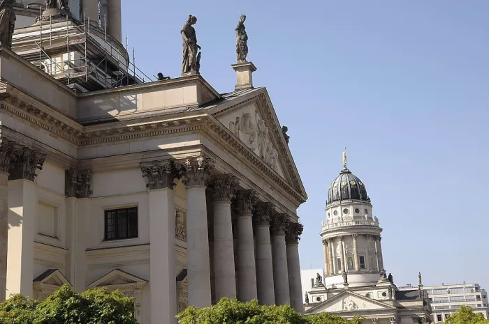 Framed Print : Close-up of historic neoclassical architecture with statues and a cathedral under a clear sky Framed Print : Close-up of historic neoclassical architecture with statues and a cathedral under a clear sky