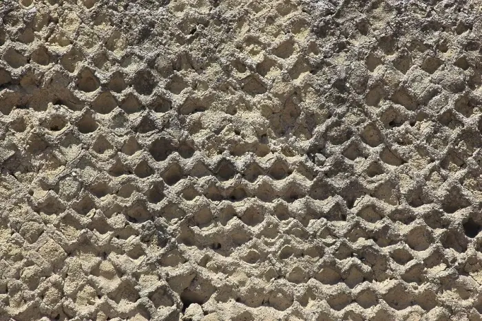 Framed Print : Close-up of a honeycomb-like, porous stone structure in natural earth tones Framed Print : Close-up of a honeycomb-like, porous stone structure in natural earth tones
