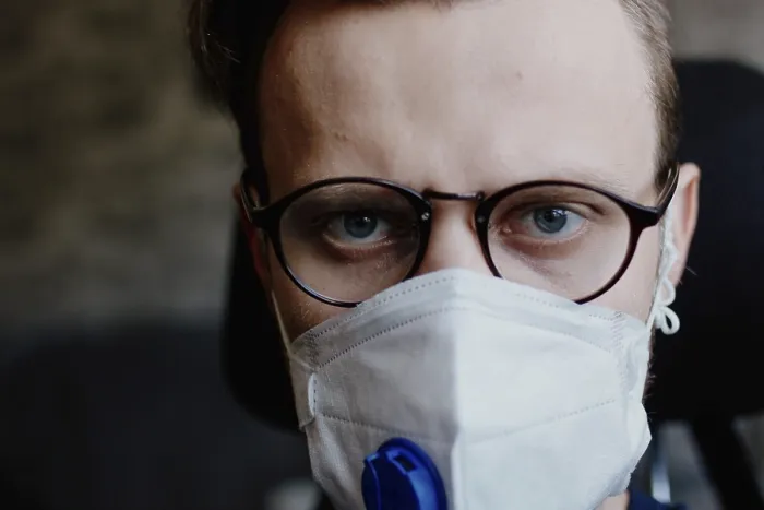 Framed Print : Close-up of a man wearing a medical mask and glasses