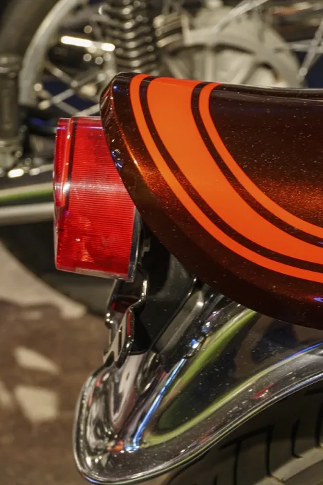 Framed Print : Close-up of a motorbike tail light with chrome details and retro stripe pattern Framed Print : Close-up of a motorbike tail light with chrome details and retro stripe pattern