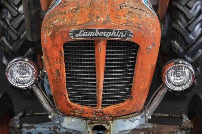Framed Print : Close-up of an old Lamborghini tractor with brand emblem