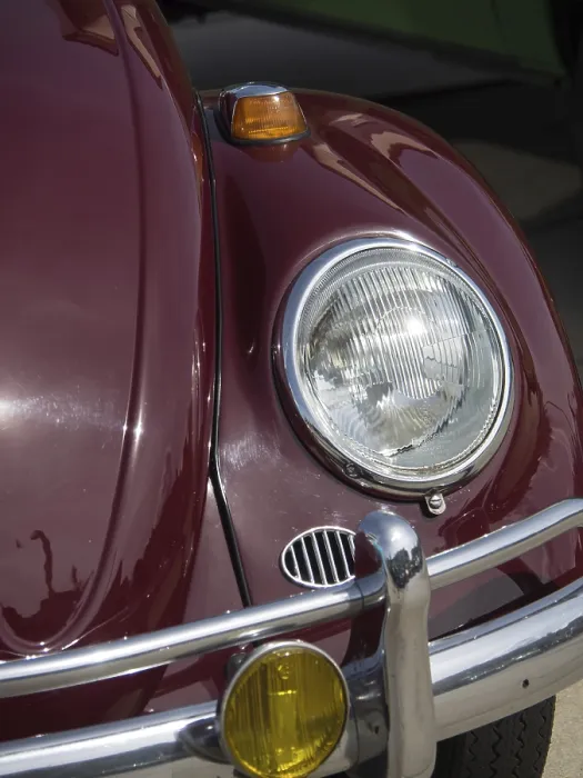 Framed Print : Close-up of a red vintage car with shiny headlight and bumper