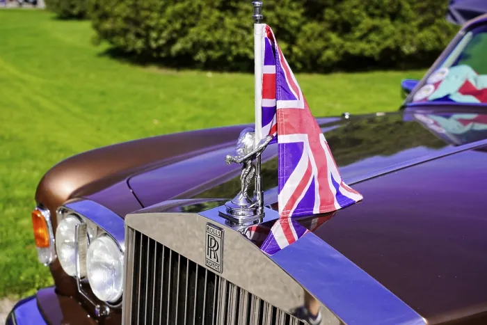 Framed Print : Close-up of a Rolls Royce with Union Jack flag and radiator grille in the foreground Framed Print : Close-up of a Rolls Royce with Union Jack flag and radiator grille in the foreground