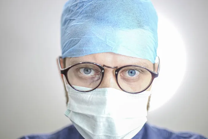 Framed Print : Close-up of a surgeon with blue cap