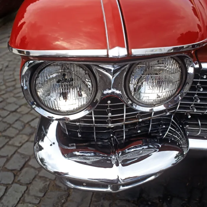 Framed Print : Close-up of twin headlights and bumper of an American road cruiser from Cadillac Framed Print : Close-up of twin headlights and bumper of an American road cruiser from Cadillac
