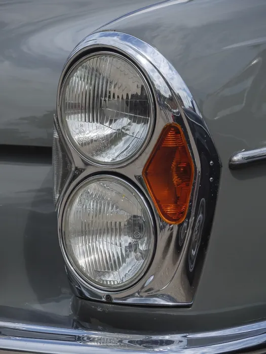 Framed Print : Close-up of a vintage car headlight with double bulbs and chrome accents Framed Print : Close-up of a vintage car headlight with double bulbs and chrome accents