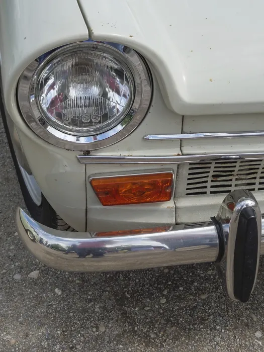 Framed Print : Close-up of a vintage car, showing the front headlight and part of the bumper
