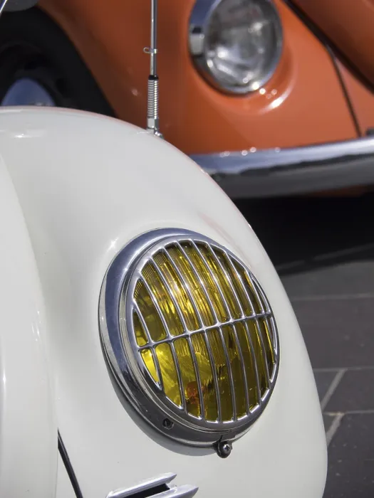 Framed Print : Close-up of a white classic car with yellow headlight