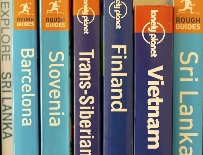 Framed Print : Close up of various travel guide books published by Lonely Planet and Rough Guides