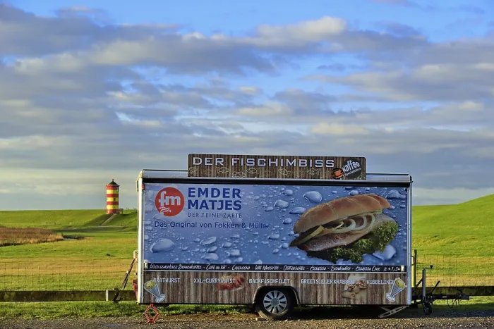 Framed Print : Closed fish snack car stands on the car park in front of the Pilsum lighthouse
