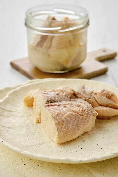Framed Print : Closeup view of canned sea trout on a plate